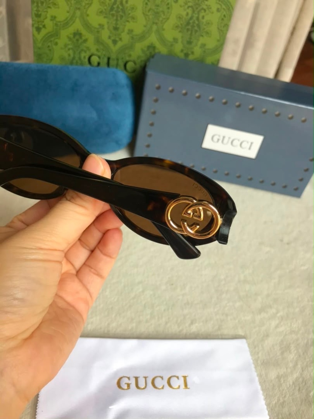 Gucci Women's Tortoiseshell Sunglasses with Gold Logo Accent